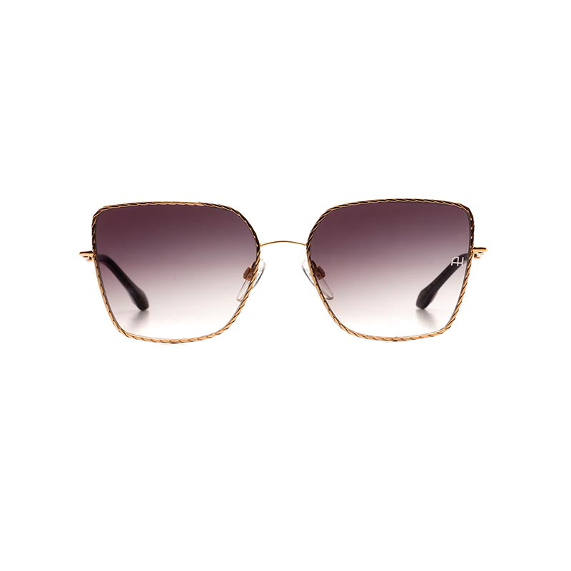 Ana Hickmann butterfly shape sunglass come in a soft gold metal colour with black acetate ends and grey graduated lenses. Front view.