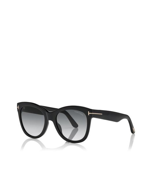Soft cat-eye acetate style sunglass in black with metal 'T' decoration.