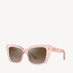 Soft square Aspinal of London sunglass. This lightweight acetate frame comes in a rose gold glass-like crystal colour with brown gradient lenses. Left angled view.