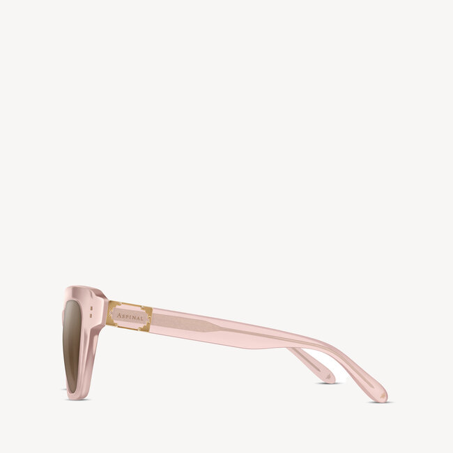Soft square Aspinal of London sunglass. This lightweight acetate frame comes in a rose gold glass-like crystal colour with brown gradient lenses. Left full view.