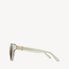 Soft square Aspinal of London sunglass. This lightweight acetate frame comes in a willow green glass-like crystal colour with brown gradient lenses. Left full view.