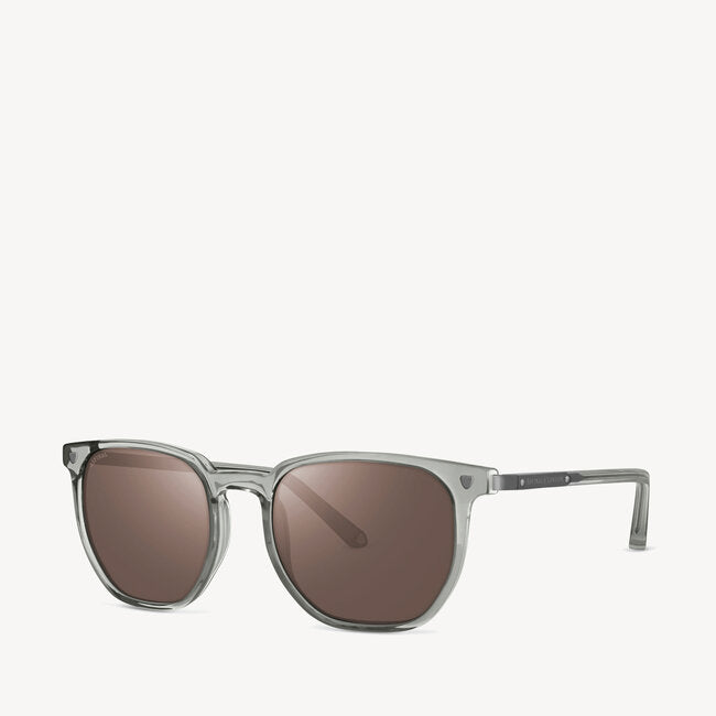 Aspinal of London men's sunglass featuring a clean geometric shape, comes in a grey crystal lightweight acetate frame with grey solid lenses. Left angled view.