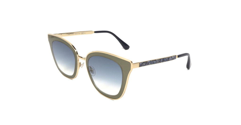 Subtle cat-eye sunglass comes in a gold and blue frame with blue gradient lenses and blue crystal embellishment on the arms. Left view.