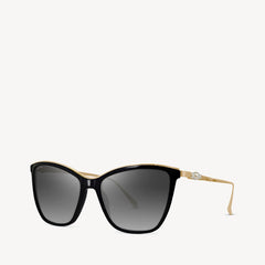 Aspinal of London sunglass is a geometric cat-eye acetate frame comes in a shiny black colour with gold tone metal arms and grey gradient lenses. Left angled view.